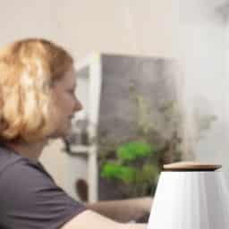Woman using a humidifier to help her ENT health