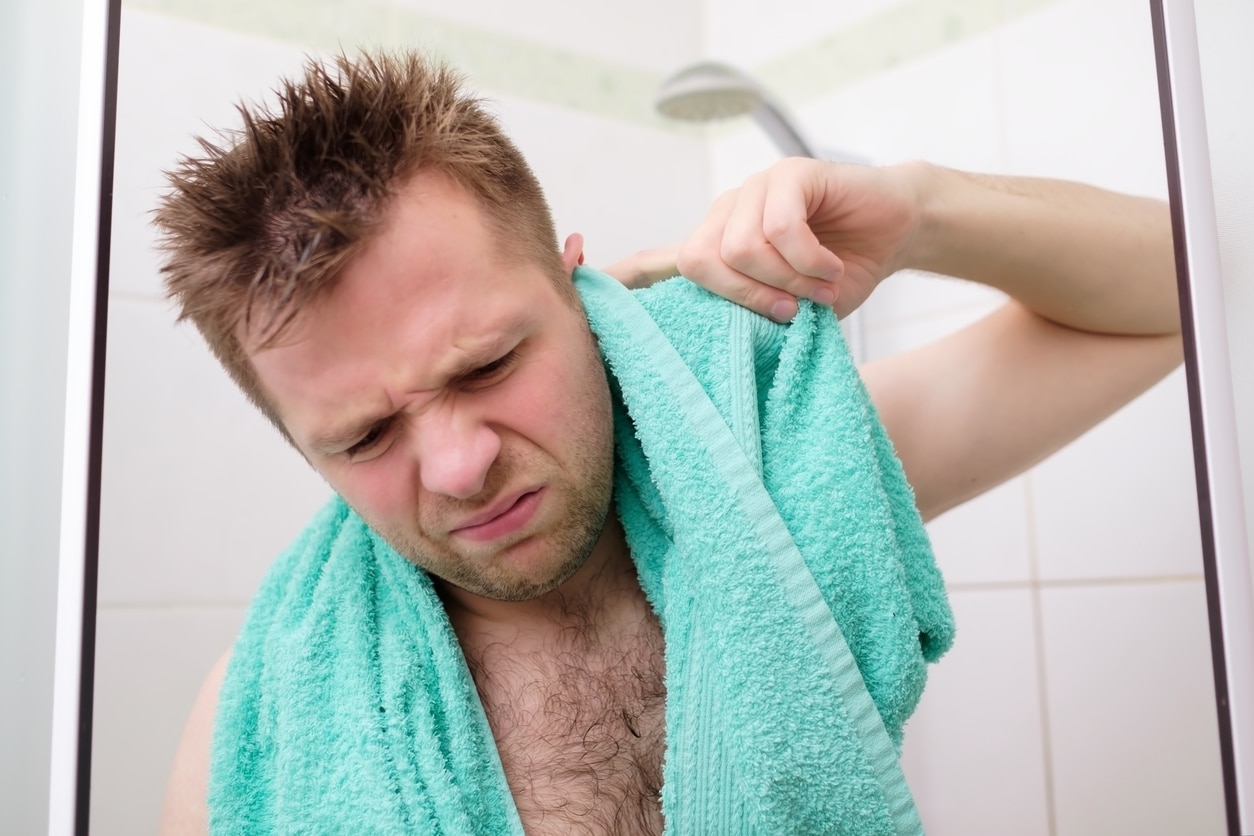 Man tries to remove water from his ears