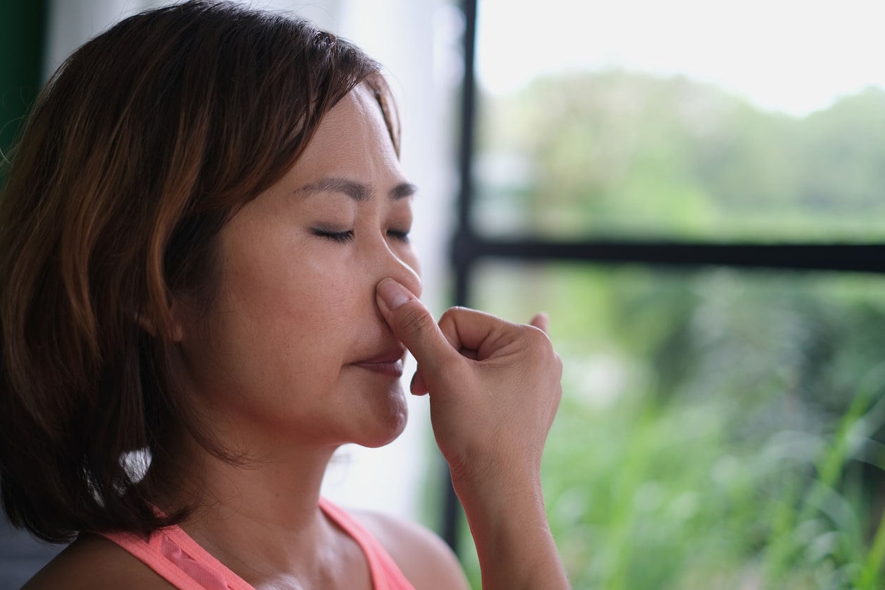  Woman breathing through her nose.