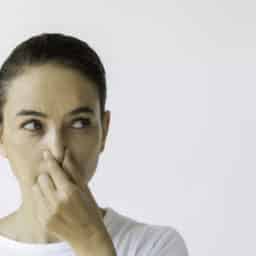 Woman pinching her nose