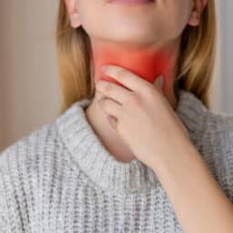 Woman with a red sore throat