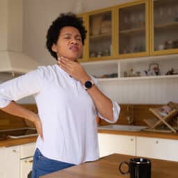 Woman with an uncomfortable feeling in her throat